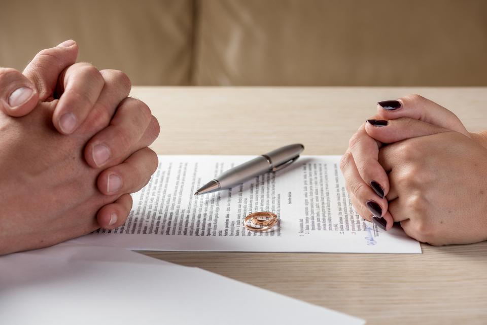 Two people at a table with agreement between them